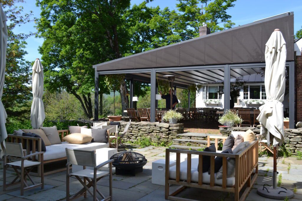 Gennius awning at resort with side screens.