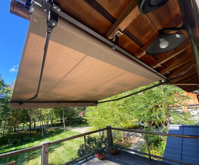 Soffit mounted rectractable awning.