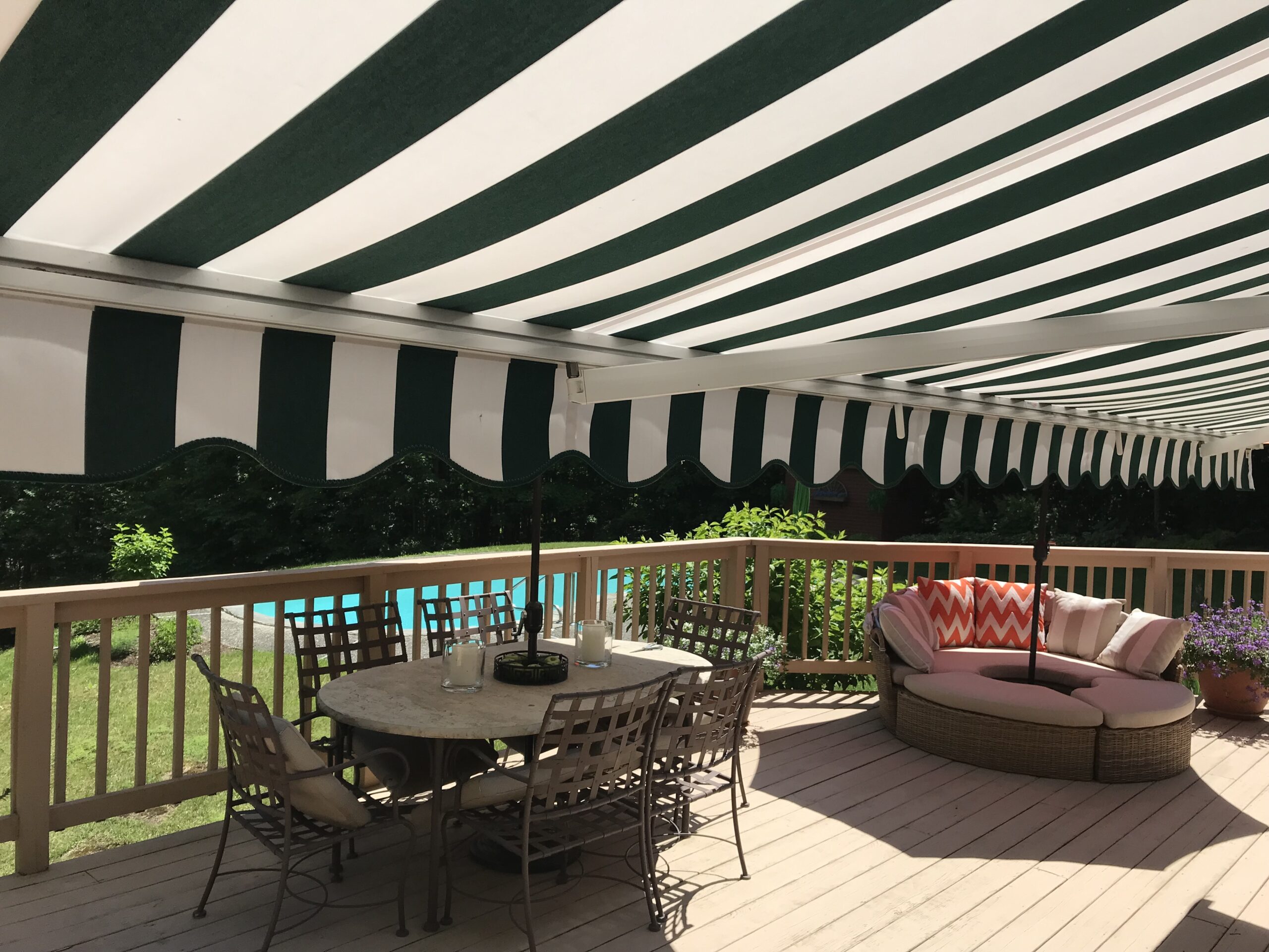 Striped green and white awning over deck